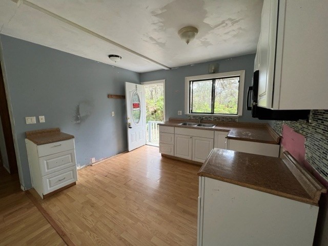 11-3715 Old Volcano Road Volcano, HI 96785 - Photo 3 of 14 a kitchen with granite countertop a sink stainless steel appliances and cabinets