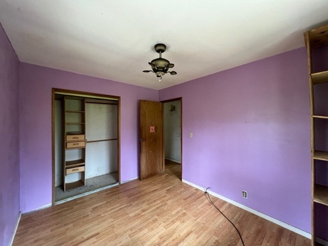 11-3715 Old Volcano Road Volcano, HI 96785 - Photo 8 of 14 a bed room with a bed and a ceiling fan