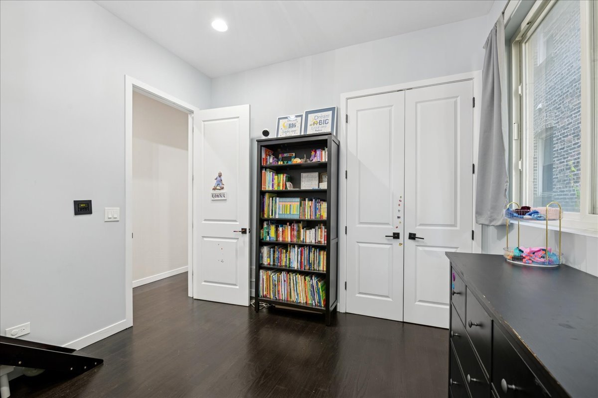 2019 North Whipple Street, Unit 1 Chicago, IL 60647 - Photo 17 of 33 a view of an empty room with cabinet and wooden floor