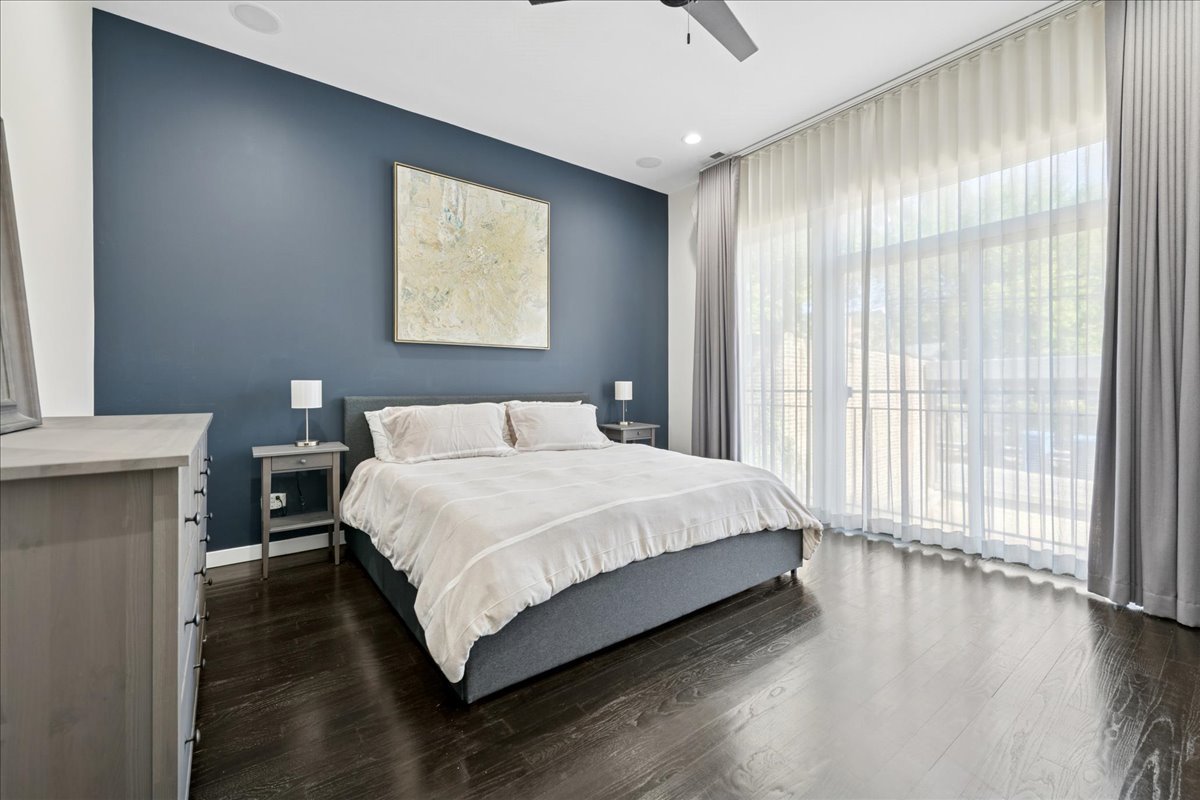 2019 North Whipple Street, Unit 1 Chicago, IL 60647 - Photo 19 of 33 a bedroom with a bed and a large window