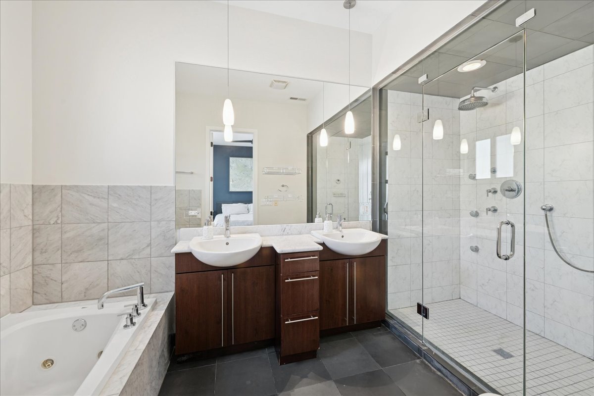 2019 North Whipple Street, Unit 1 Chicago, IL 60647 - Photo 21 of 33 a bathroom with a tub sink shower and mirror