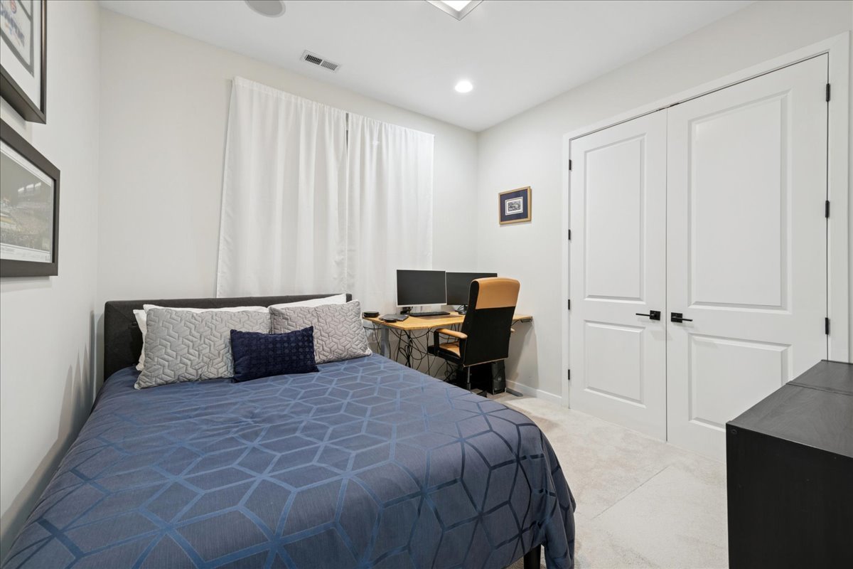 2019 North Whipple Street, Unit 1 Chicago, IL 60647 - Photo 27 of 33 a bedroom with a bed and a couch