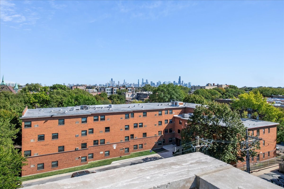 2019 North Whipple Street, Unit 1 Chicago, IL 60647 - Photo 30 of 33 a view of a building with wooden fence
