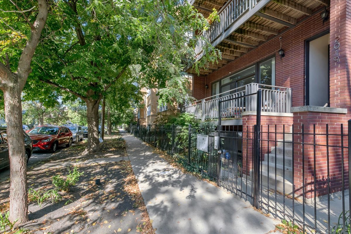 2019 North Whipple Street, Unit 1 Chicago, IL 60647 - Photo 32 of 33 a backyard of a house with lots of green space
