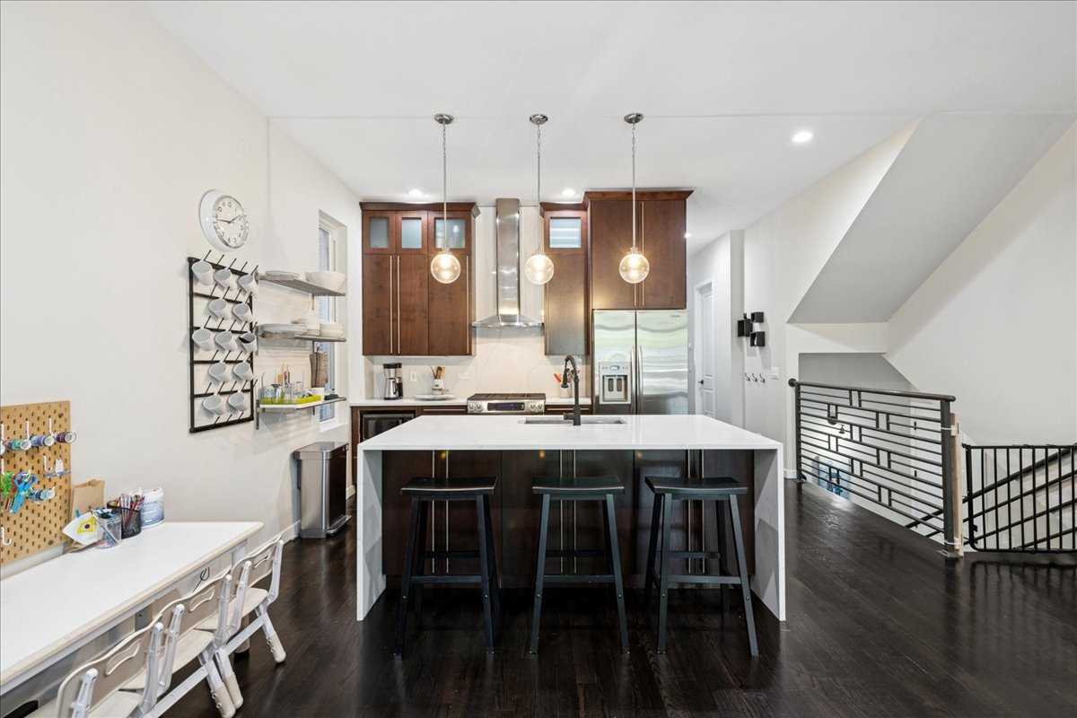 2019 North Whipple Street, Unit 1 Chicago, IL 60647 - Photo 8 of 33 a view of a kitchen with a table and chairs