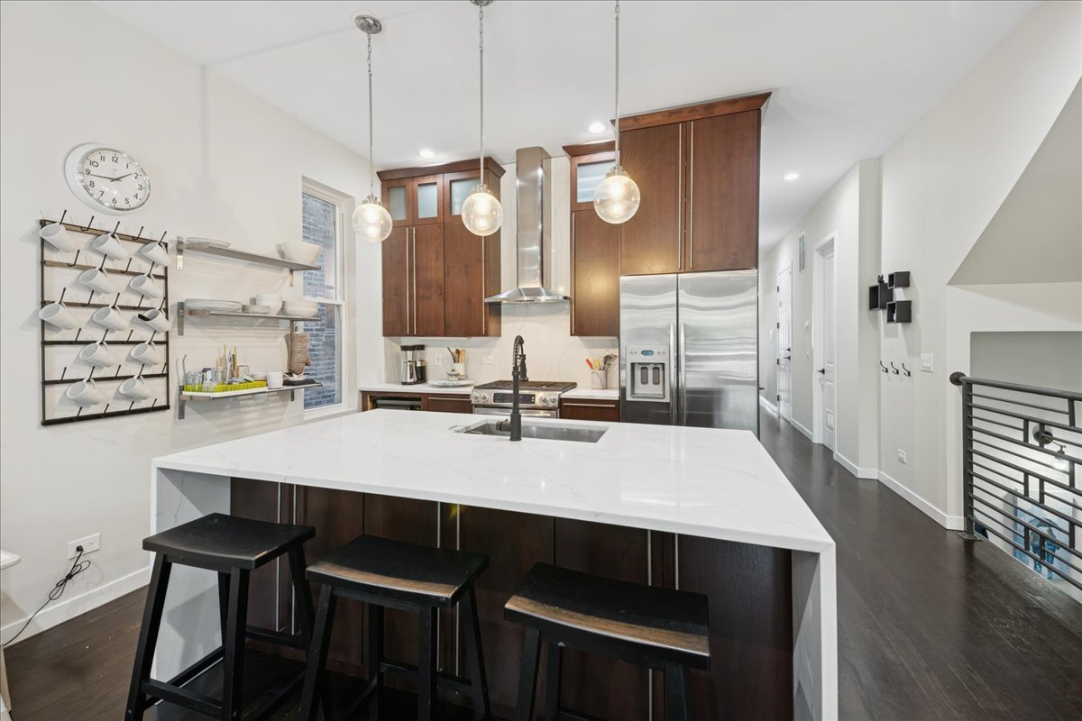 2019 North Whipple Street, Unit 1 Chicago, IL 60647 - Photo 9 of 33 a large kitchen with a table and chairs