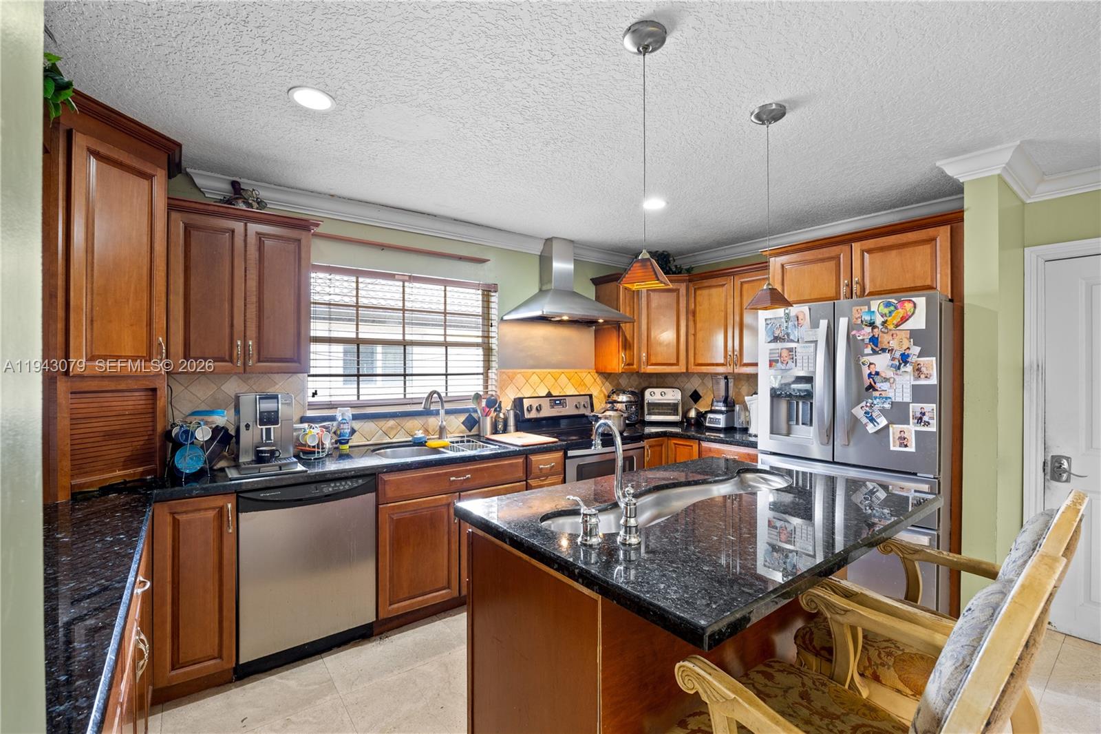 15330 Southwest 170th Terrace Miami, FL 33187 - Photo 11 of 39 Kitchen with granite top counters.