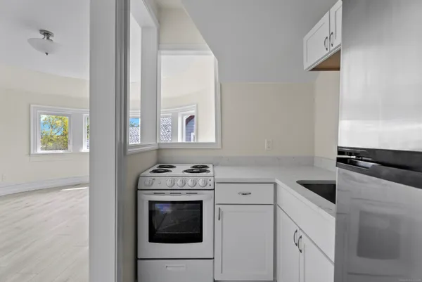a kitchen with a stove and a microwave