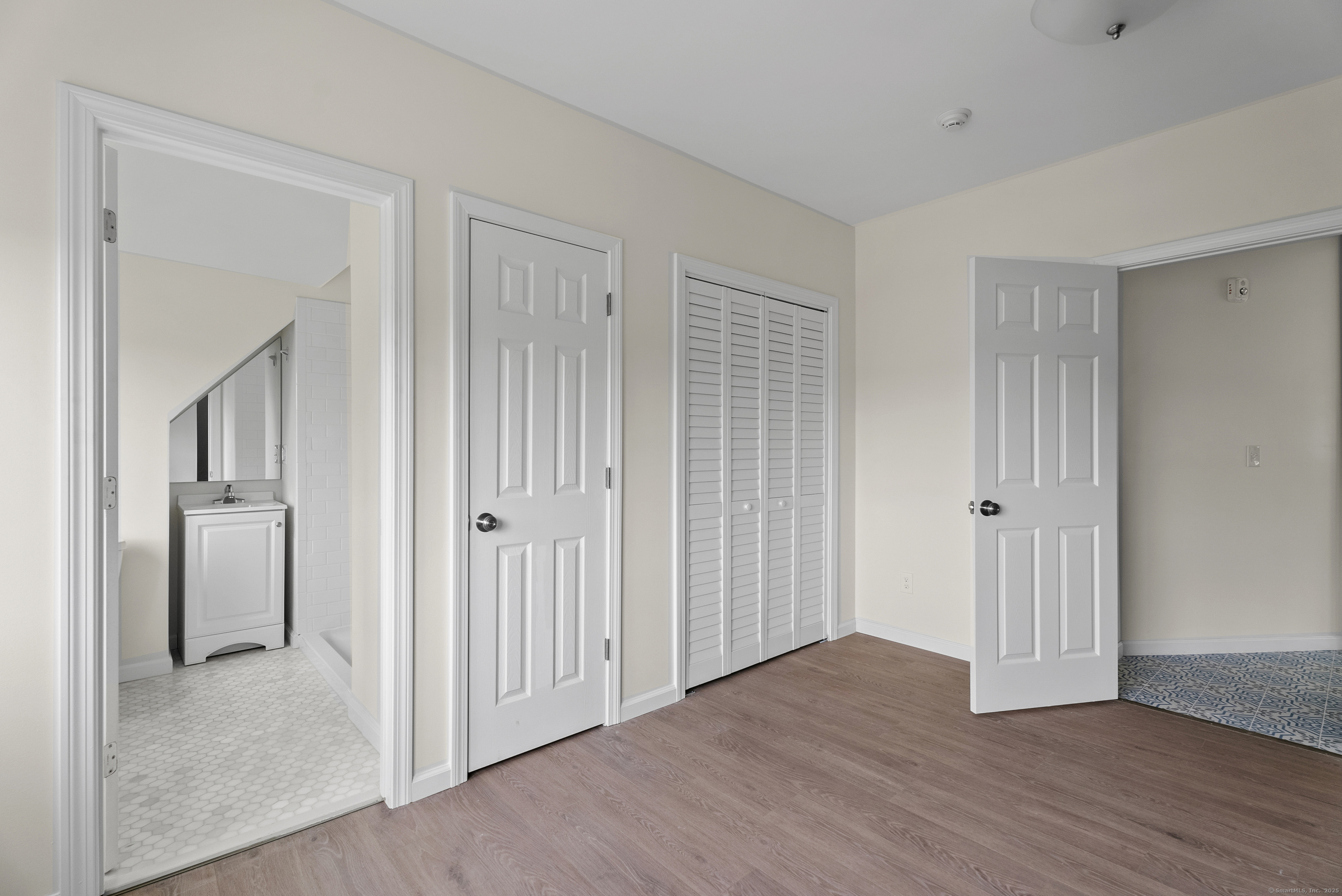 72 South Main Street, Unit 3A Wallingford, CT 06492 - Photo 10 of 14 a view of a hallway with wooden floor