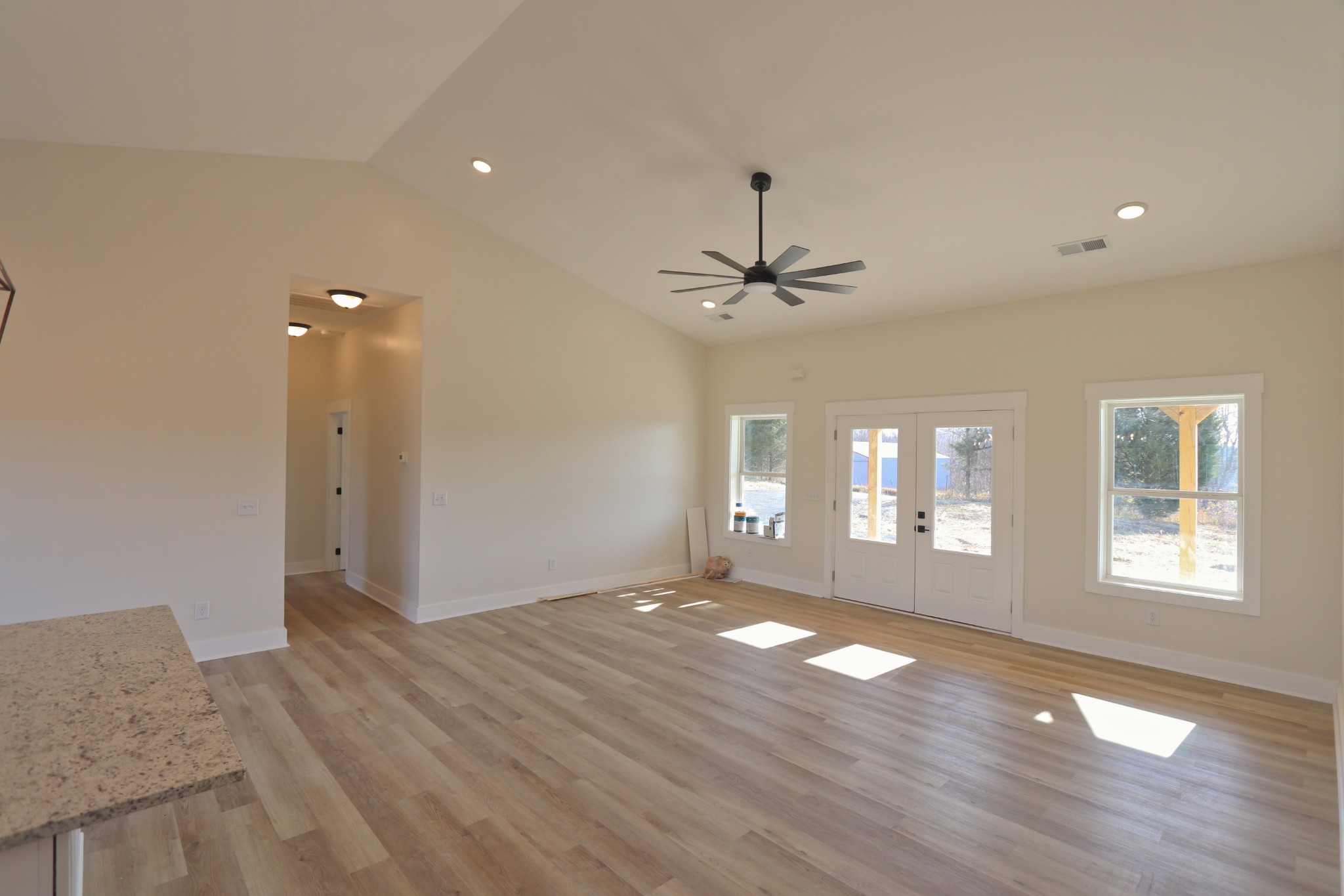 2679 Dotson Road Lafayette, TN 37083 - Photo 10 of 25 an empty room with wooden floor and windows