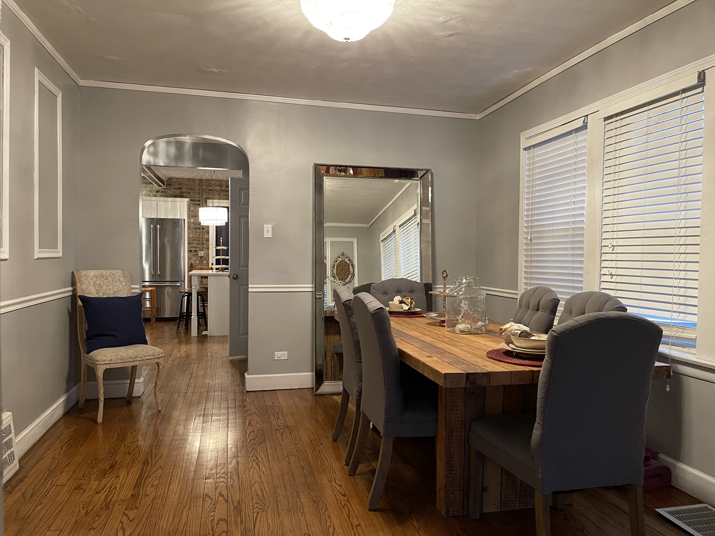 10441 South Prairie Avenue Chicago, IL 60628 - Photo 14 of 36 a dining room with furniture and wooden floor