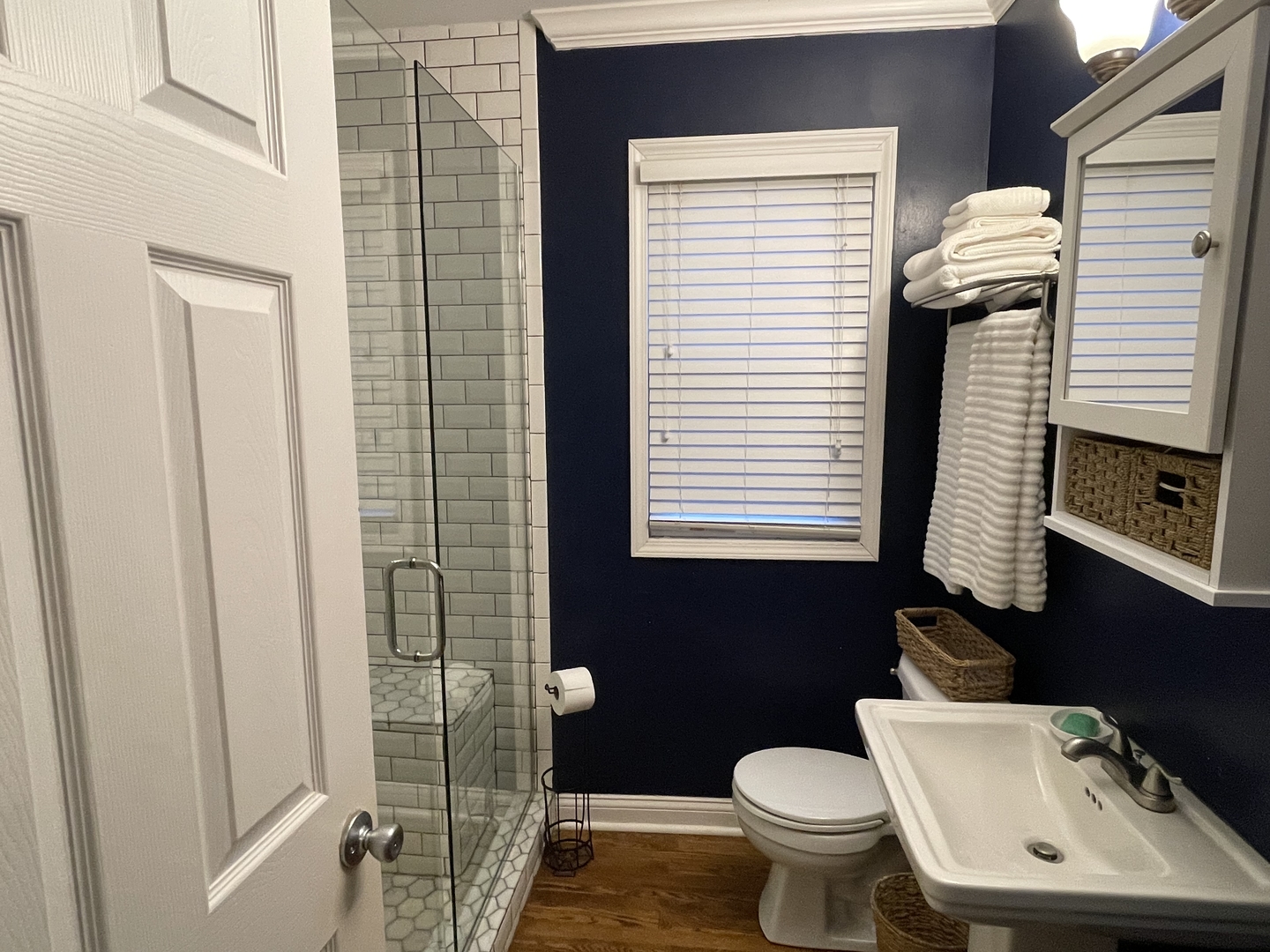 10441 South Prairie Avenue Chicago, IL 60628 - Photo 17 of 36 a bathroom with a toilet a sink and a window