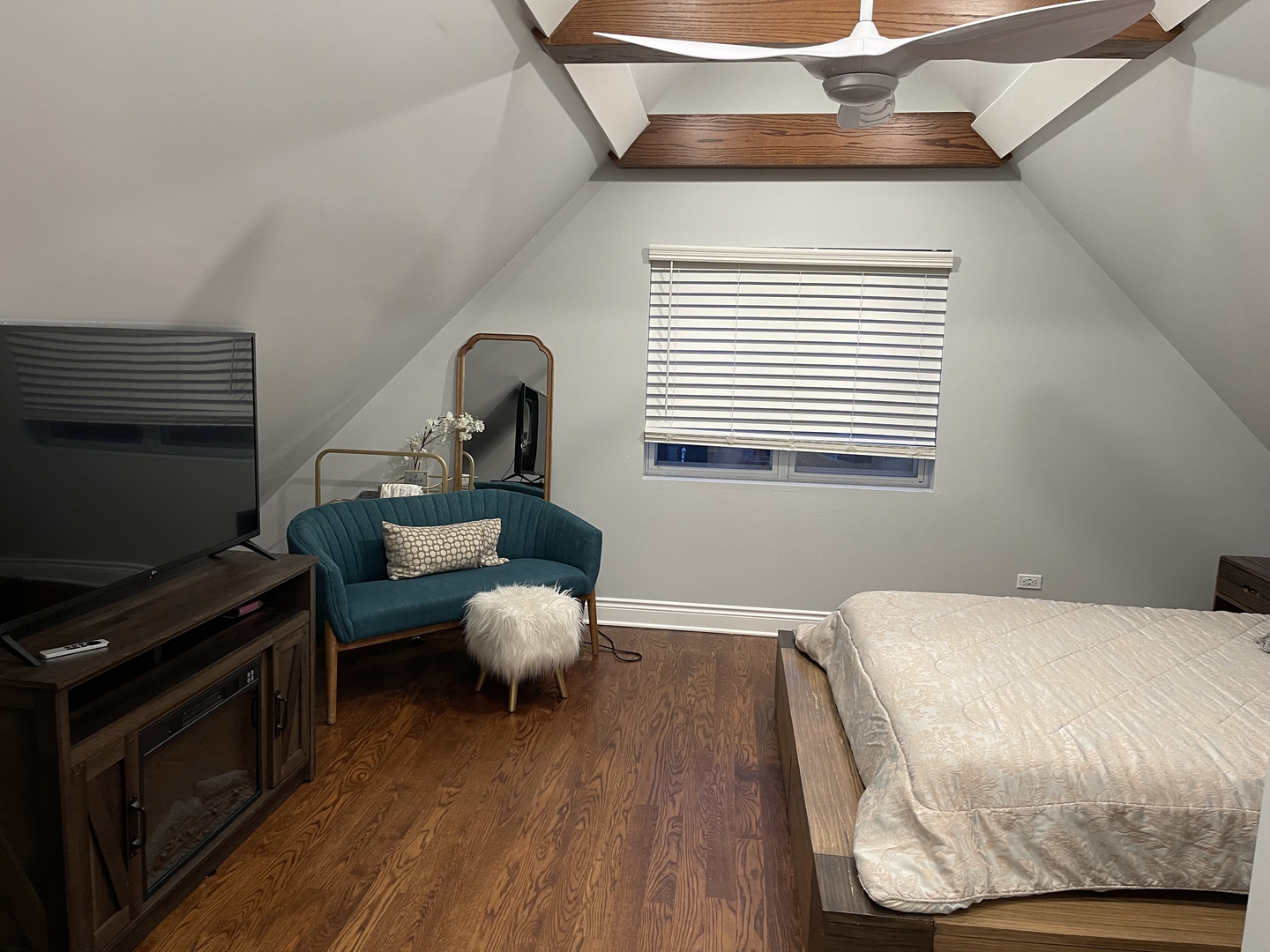 10441 South Prairie Avenue Chicago, IL 60628 - Photo 23 of 36 a bedroom with a bed and a flat screen tv