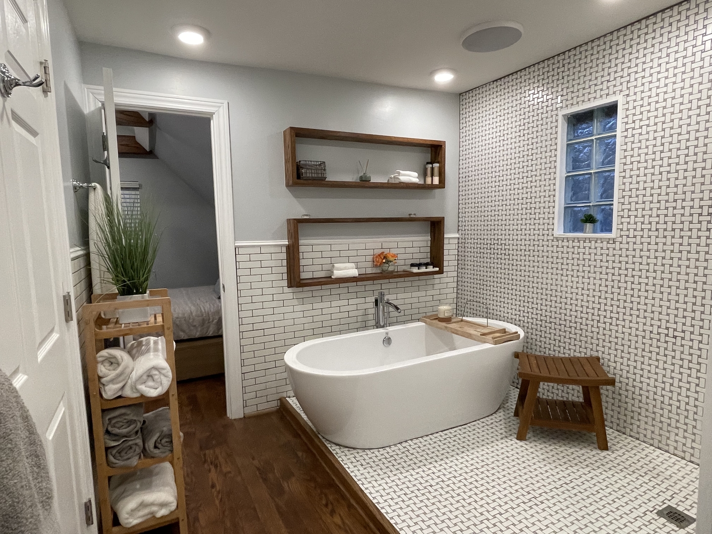 10441 South Prairie Avenue Chicago, IL 60628 - Photo 27 of 36 a spacious bathroom with a double vanity sink a mirror and a bathtub