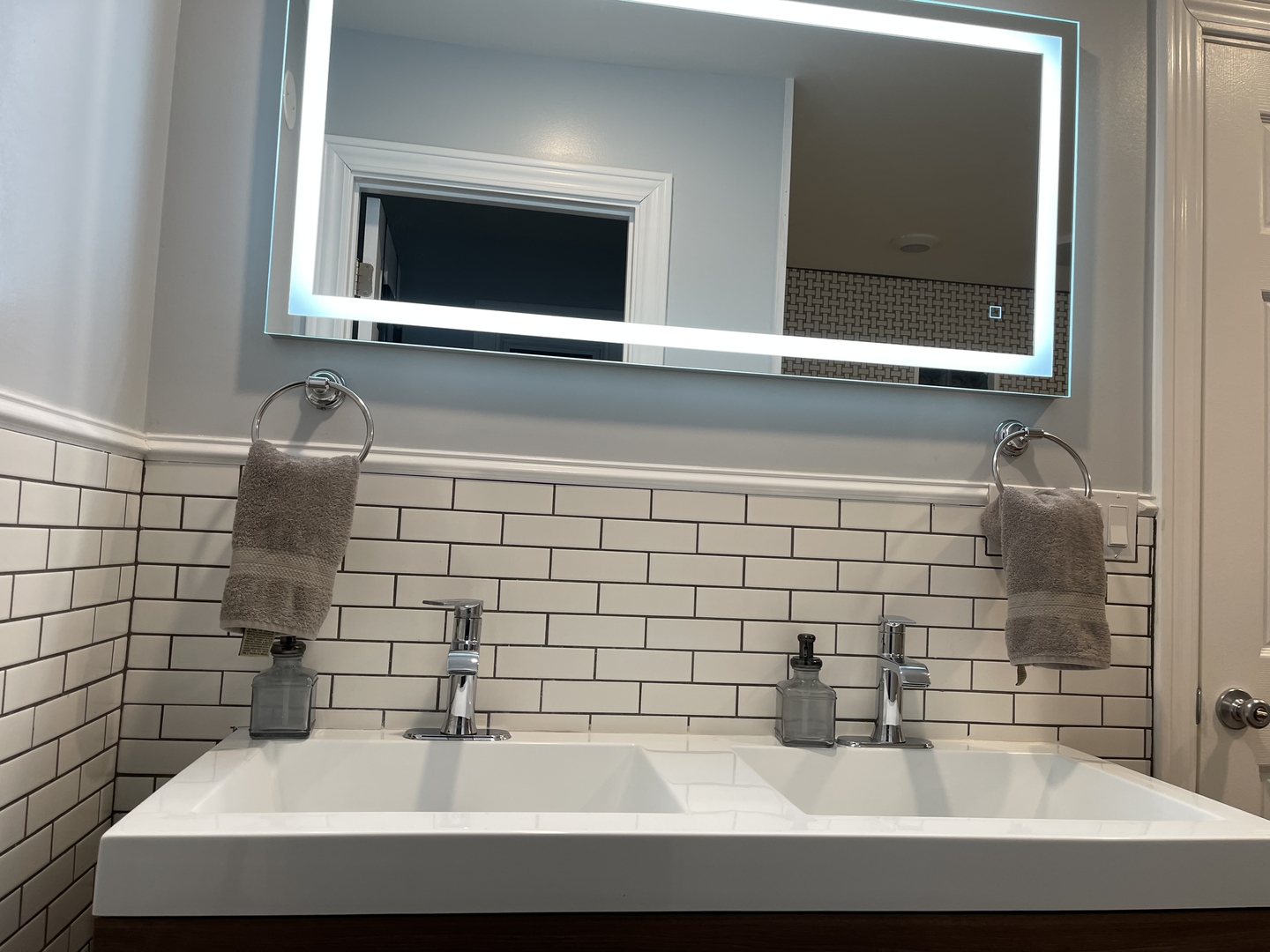 10441 South Prairie Avenue Chicago, IL 60628 - Photo 29 of 36 a bathroom with a sink and a mirror