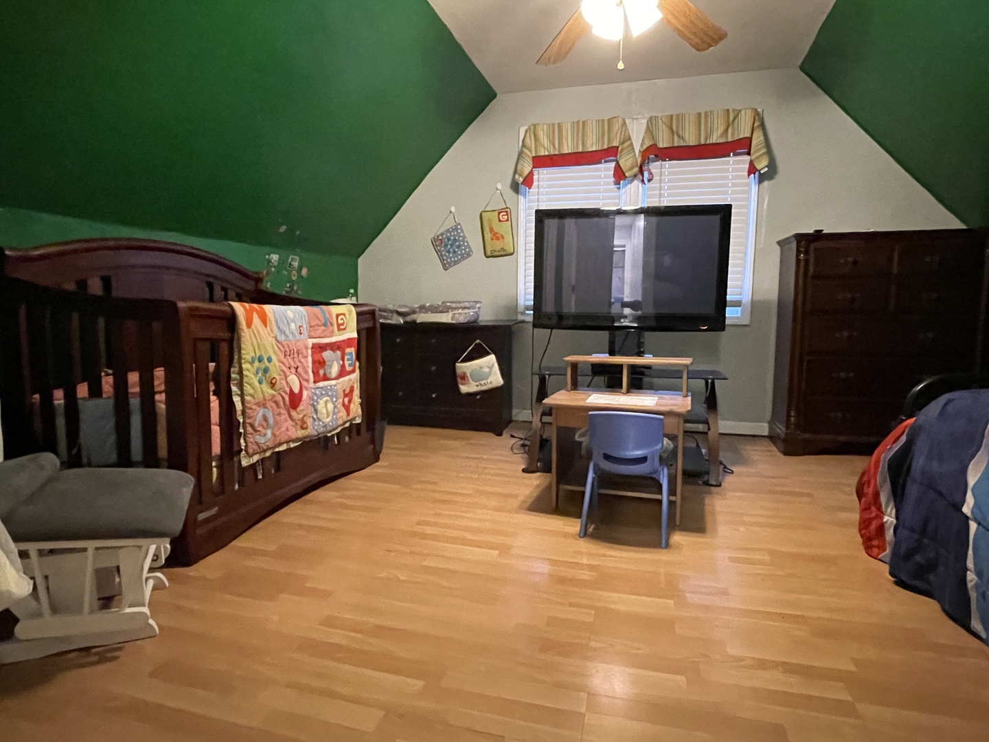 10441 South Prairie Avenue Chicago, IL 60628 - Photo 30 of 36 a living room with furniture and a flat screen tv