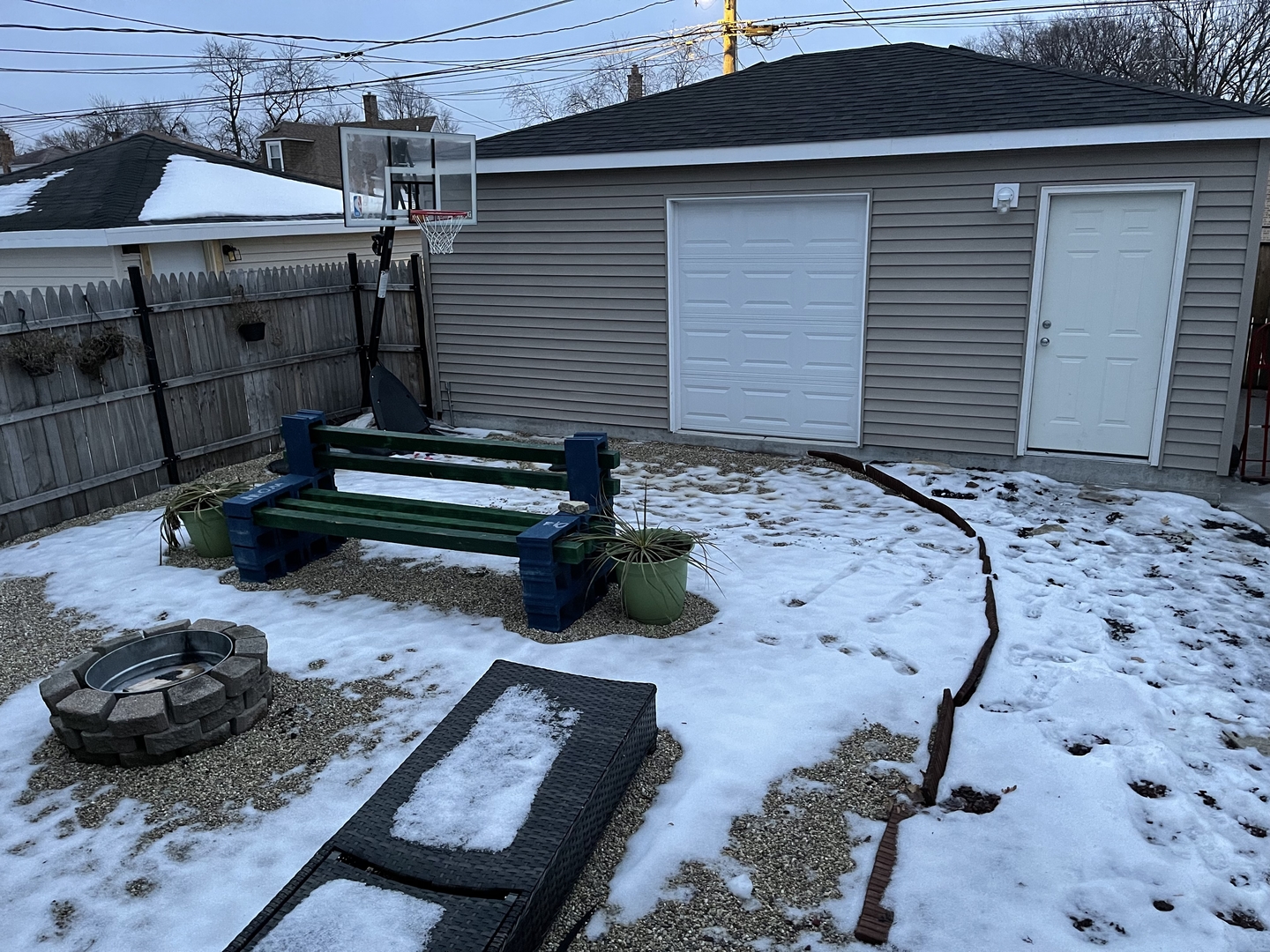 10441 South Prairie Avenue Chicago, IL 60628 - Photo 34 of 36 a backyard of a house with seating space