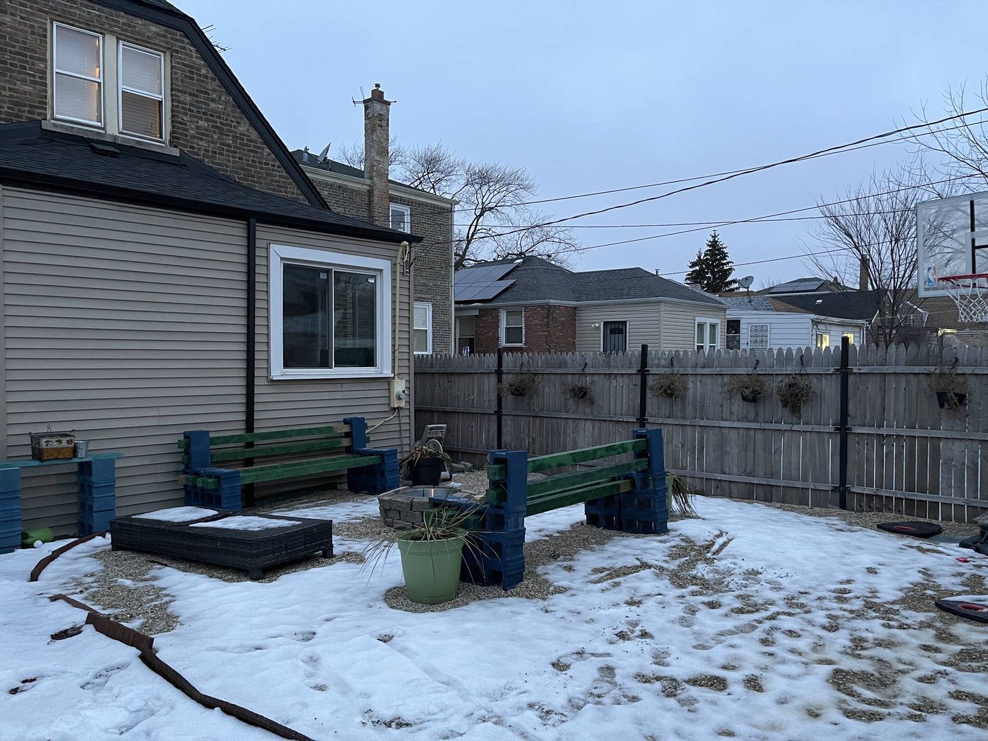 10441 South Prairie Avenue Chicago, IL 60628 - Photo 35 of 36 a view of a house with wooden fence next to a road