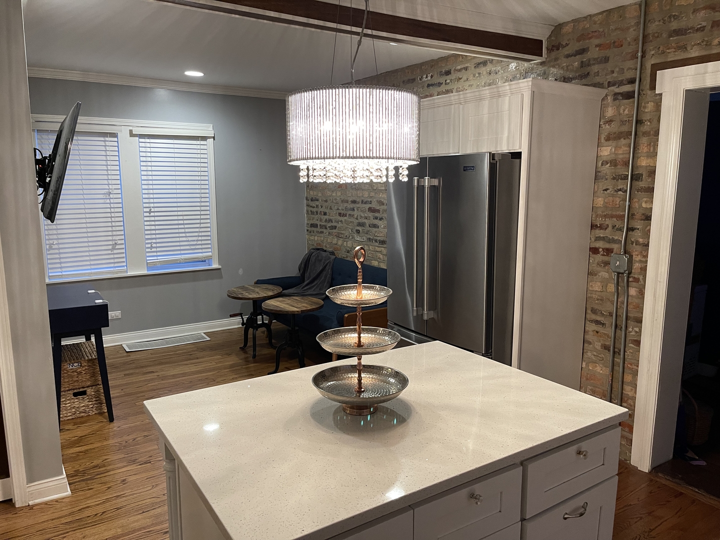 10441 South Prairie Avenue Chicago, IL 60628 - Photo 9 of 36 a kitchen with a sink a refrigerator and a table