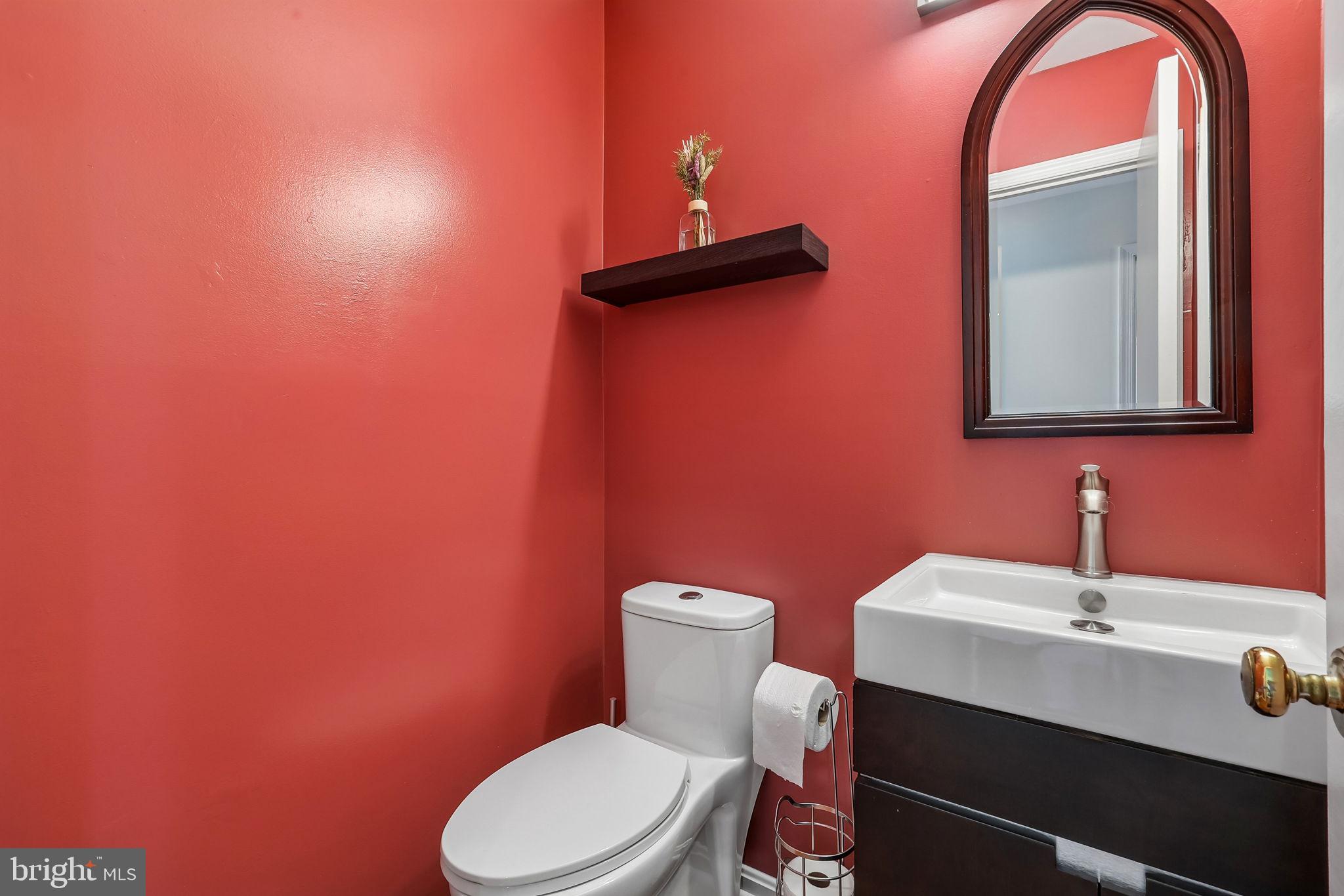 11714 Dry River Court Reston, VA 20191 - Photo 8 of 24 a bathroom with a toilet a sink and mirror