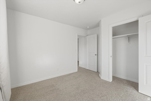 1218 Moonlight Drive Elk Ridge, UT 84651 - Photo 19 of 44 Unfurnished bedroom featuring light carpet and a closet