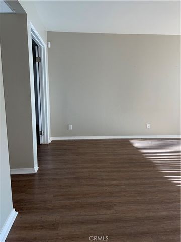 a view of room with wooden floor