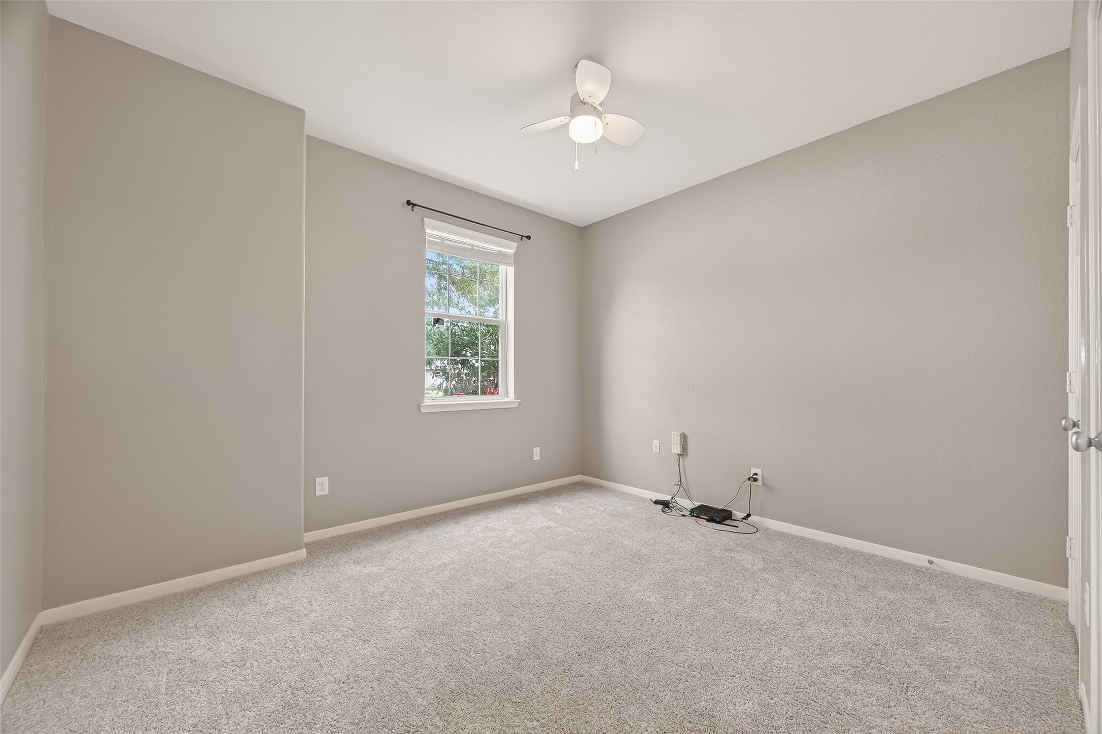 9110 Cavalier Lane Rosenberg, TX 77469 - Photo 20 of 30 This secondary bedroom is a versatile space suitable for a bedroom or home office.