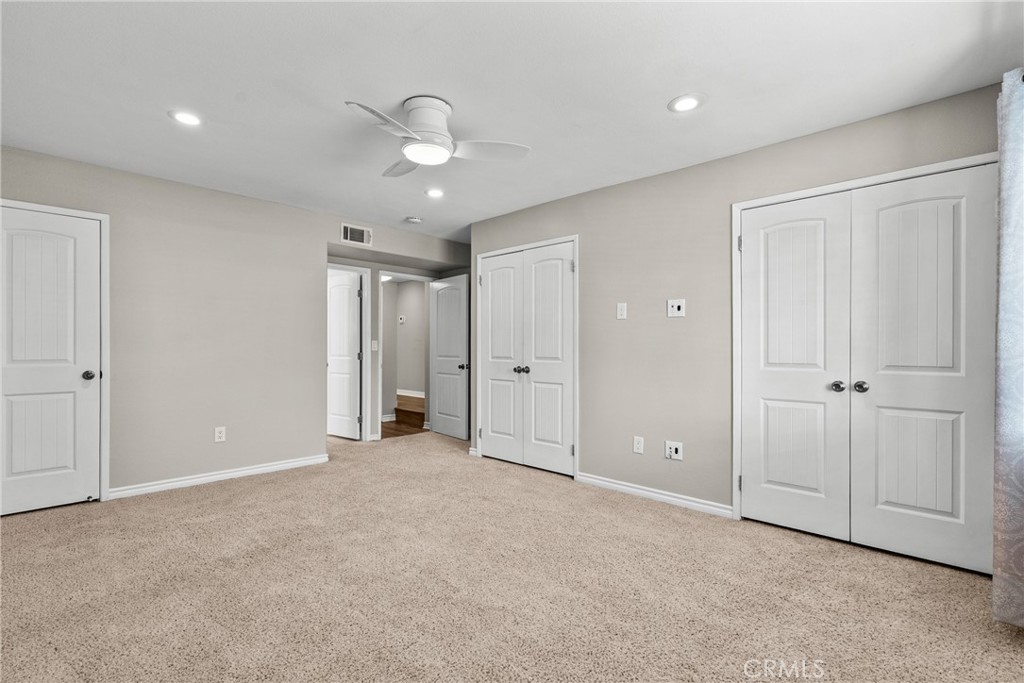 19573 Pine Valley Avenue Porter Ranch, CA 91326 - Photo 11 of 48 an empty room with closet and windows