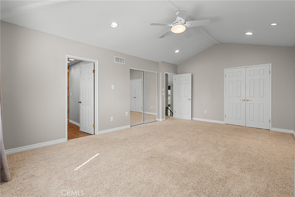 19573 Pine Valley Avenue Porter Ranch, CA 91326 - Photo 26 of 48 a view of an empty room with a ceiling fan