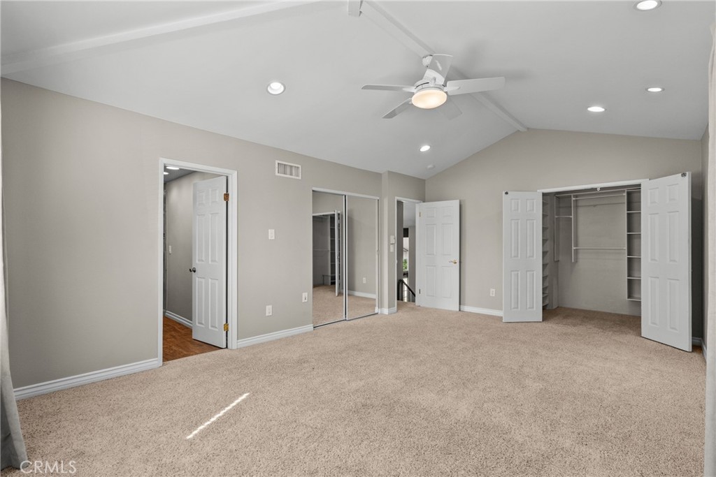 19573 Pine Valley Avenue Porter Ranch, CA 91326 - Photo 27 of 48 a view of an empty room with a ceiling fan