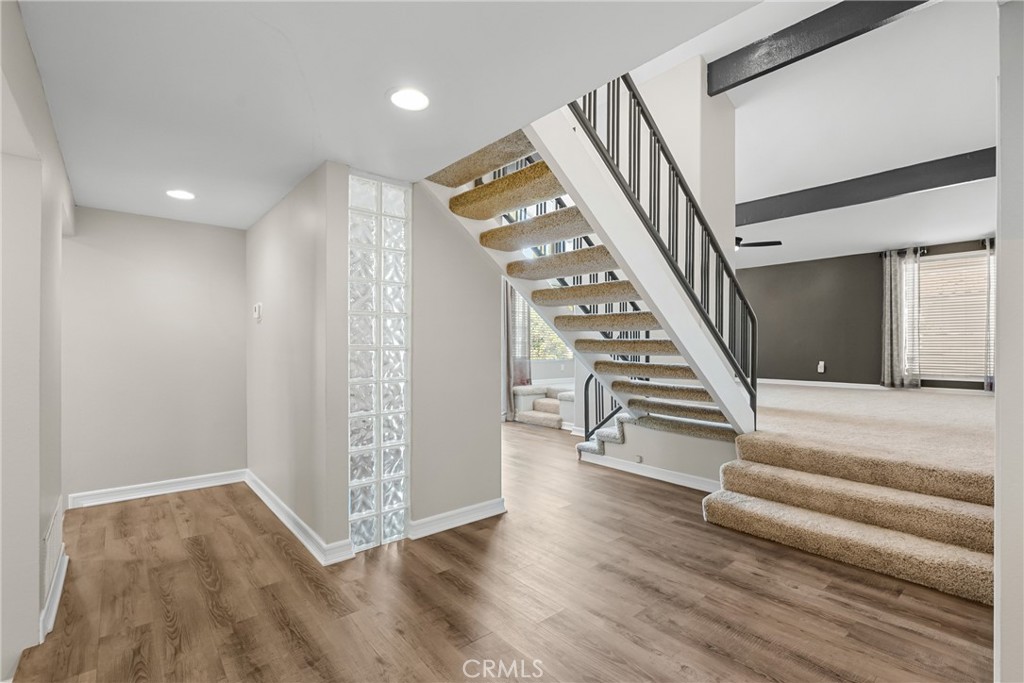 19573 Pine Valley Avenue Porter Ranch, CA 91326 - Photo 4 of 48 a view of entryway and hall with wooden floor