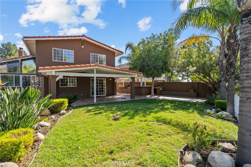 19573 Pine Valley Avenue Porter Ranch, CA 91326 - Photo 42 of 48 a view of a house with a yard