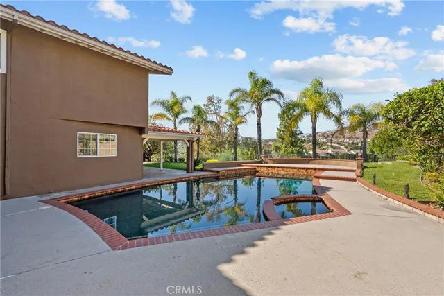 a view of swimming pool with seating area