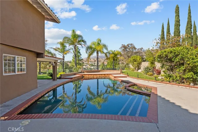 a view of swimming pool with outdoor seating