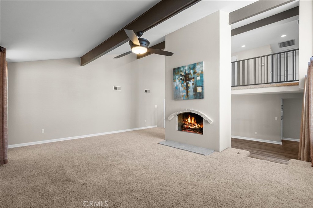 19573 Pine Valley Avenue Porter Ranch, CA 91326 - Photo 7 of 48 an empty room with ceiling fan and window