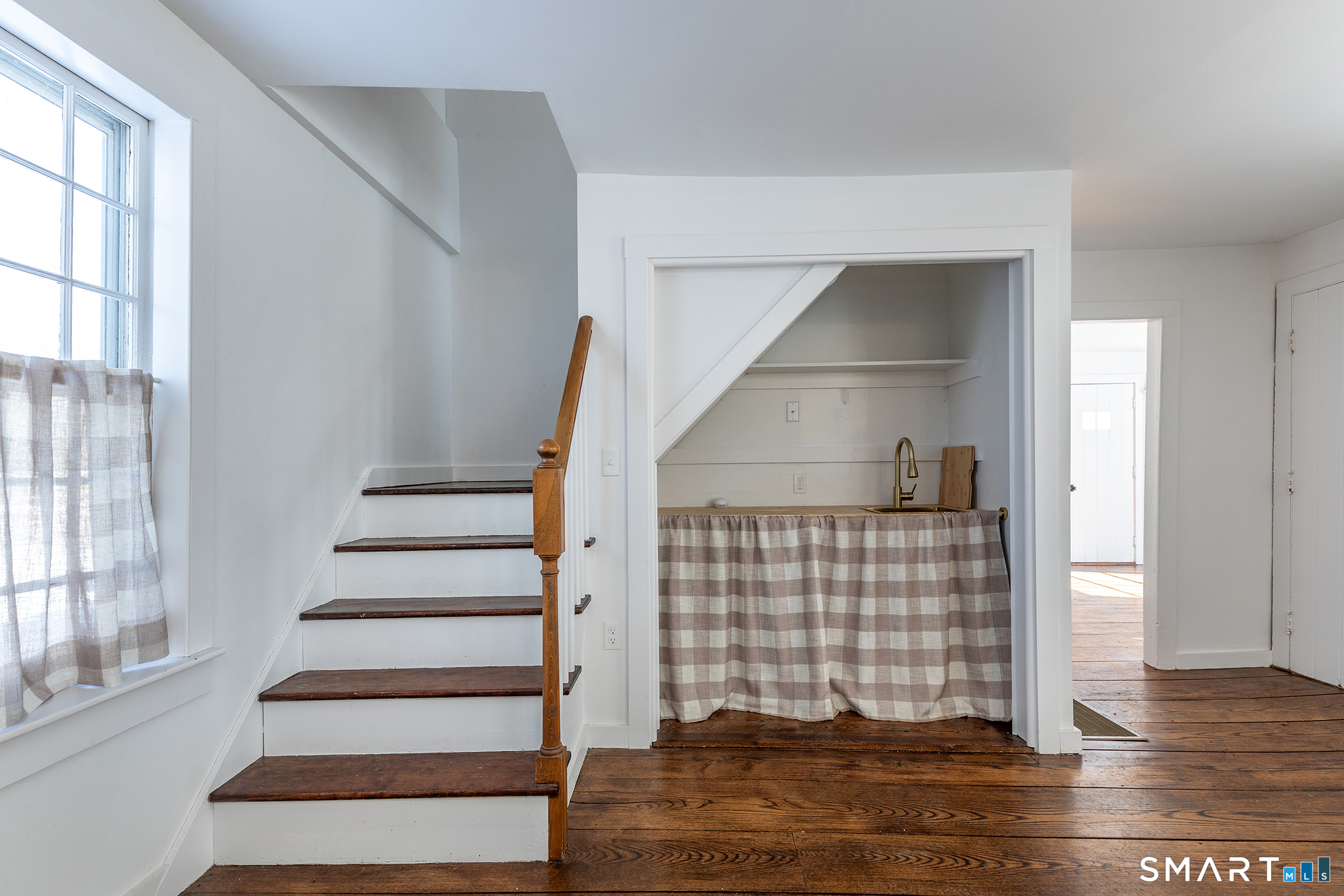 403 Beach Street Litchfield, CT 06759 - Photo 12 of 31 Dining area of kitchen with rear staircase and coffee bar nook with sink.