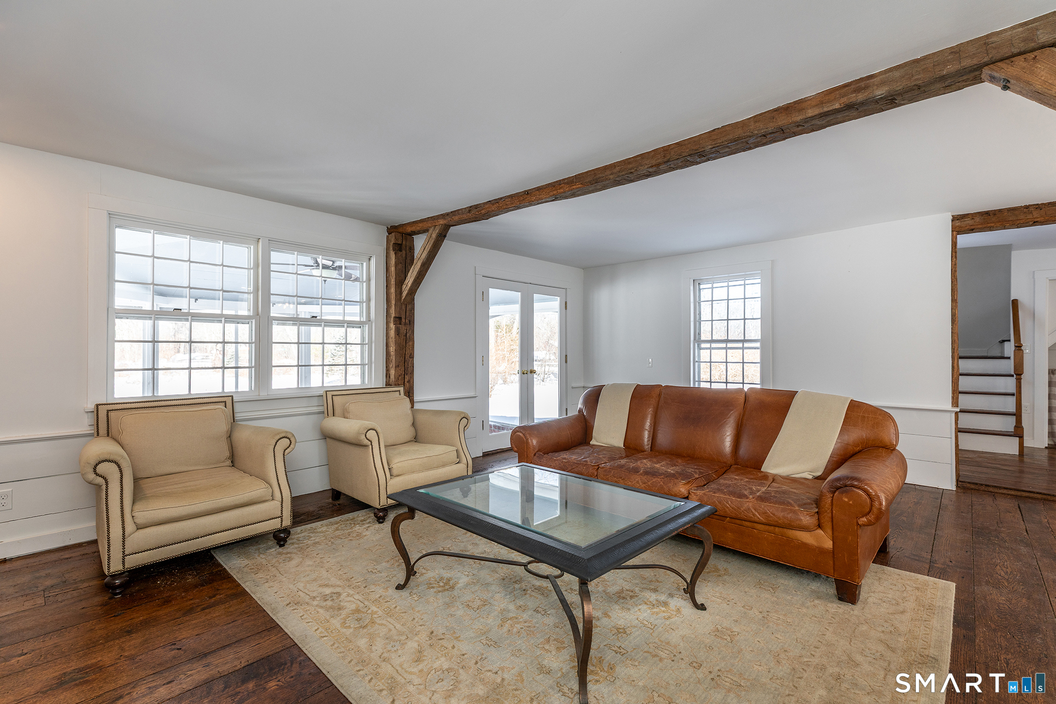 403 Beach Street Litchfield, CT 06759 - Photo 17 of 34 a living room with furniture and a large window