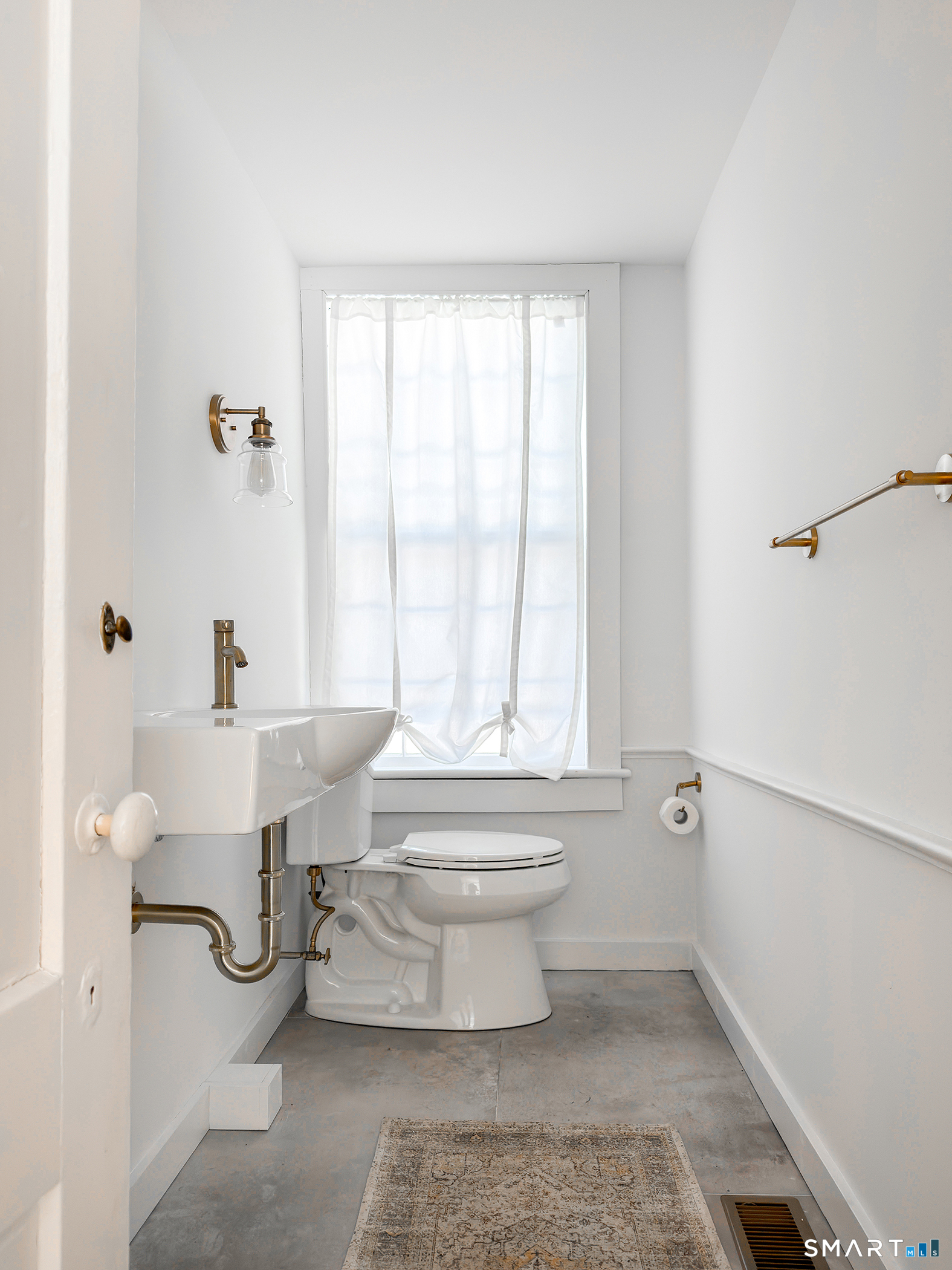 403 Beach Street Litchfield, CT 06759 - Photo 19 of 34 a bathroom with a toilet a sink and a bathtub