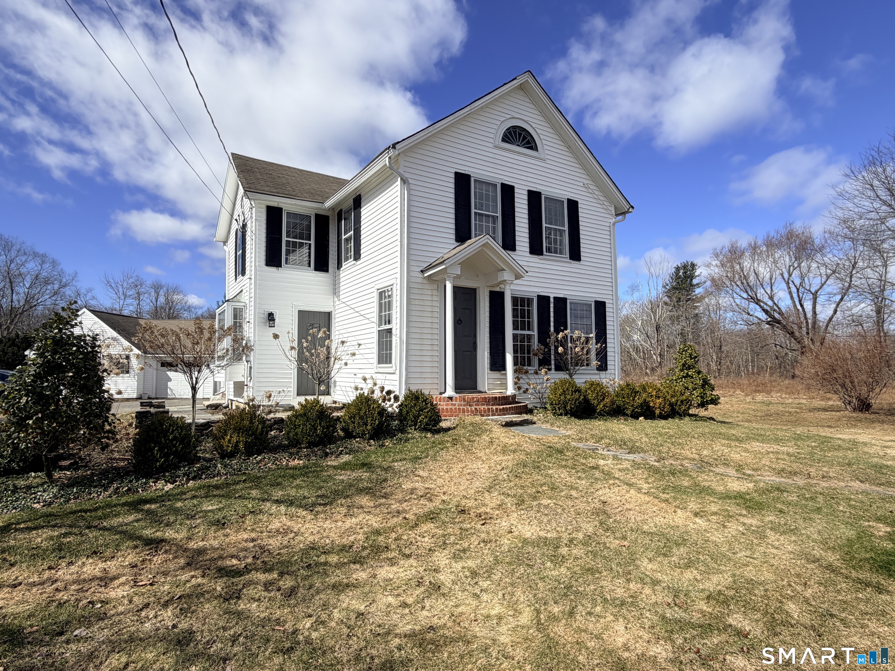 403 Beach Street Litchfield, CT 06759 - Photo 2 of 34 a front view of a house with a yard