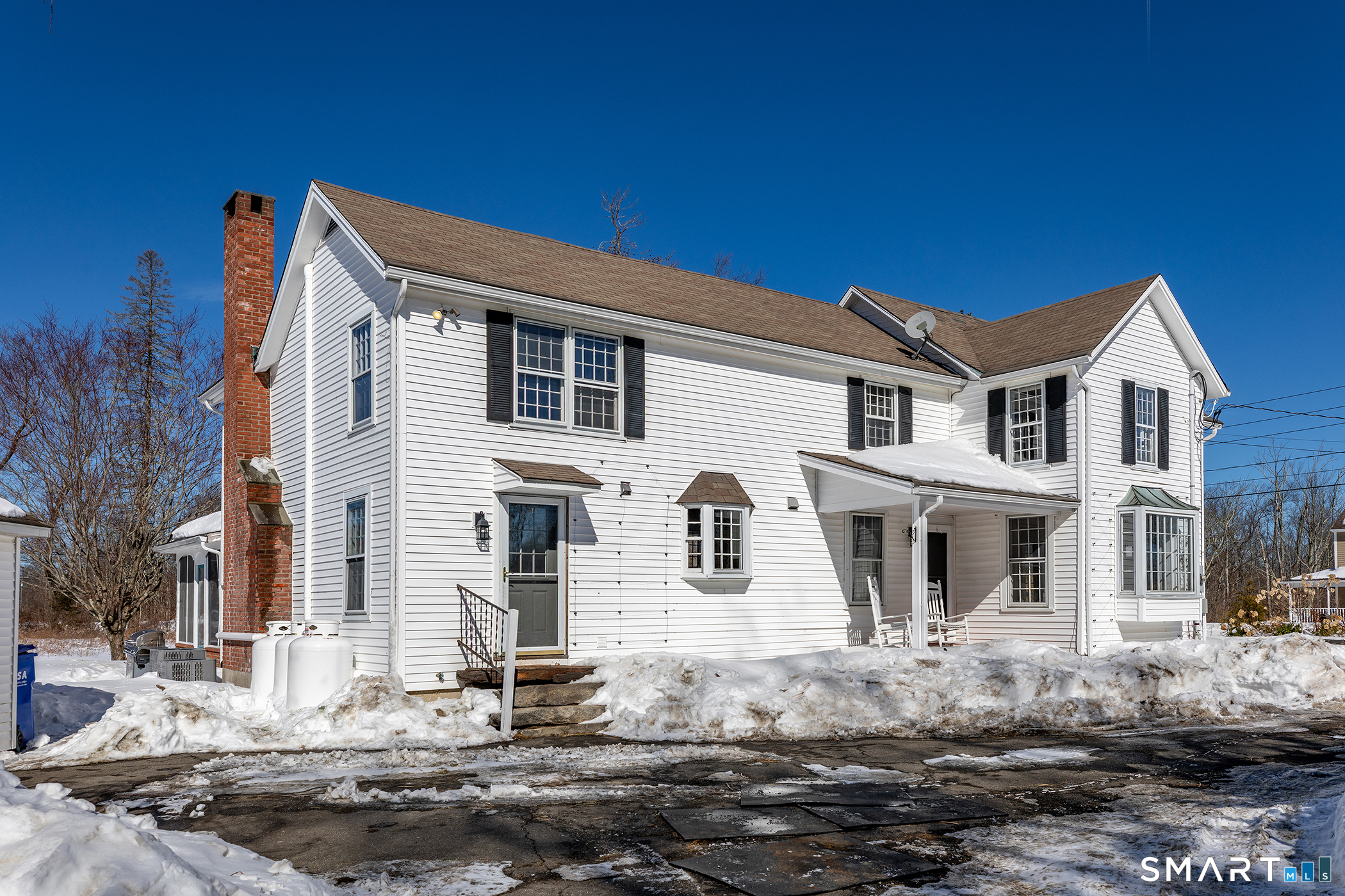 403 Beach Street Litchfield, CT 06759 - Photo 32 of 34 a front view of a house with a tree