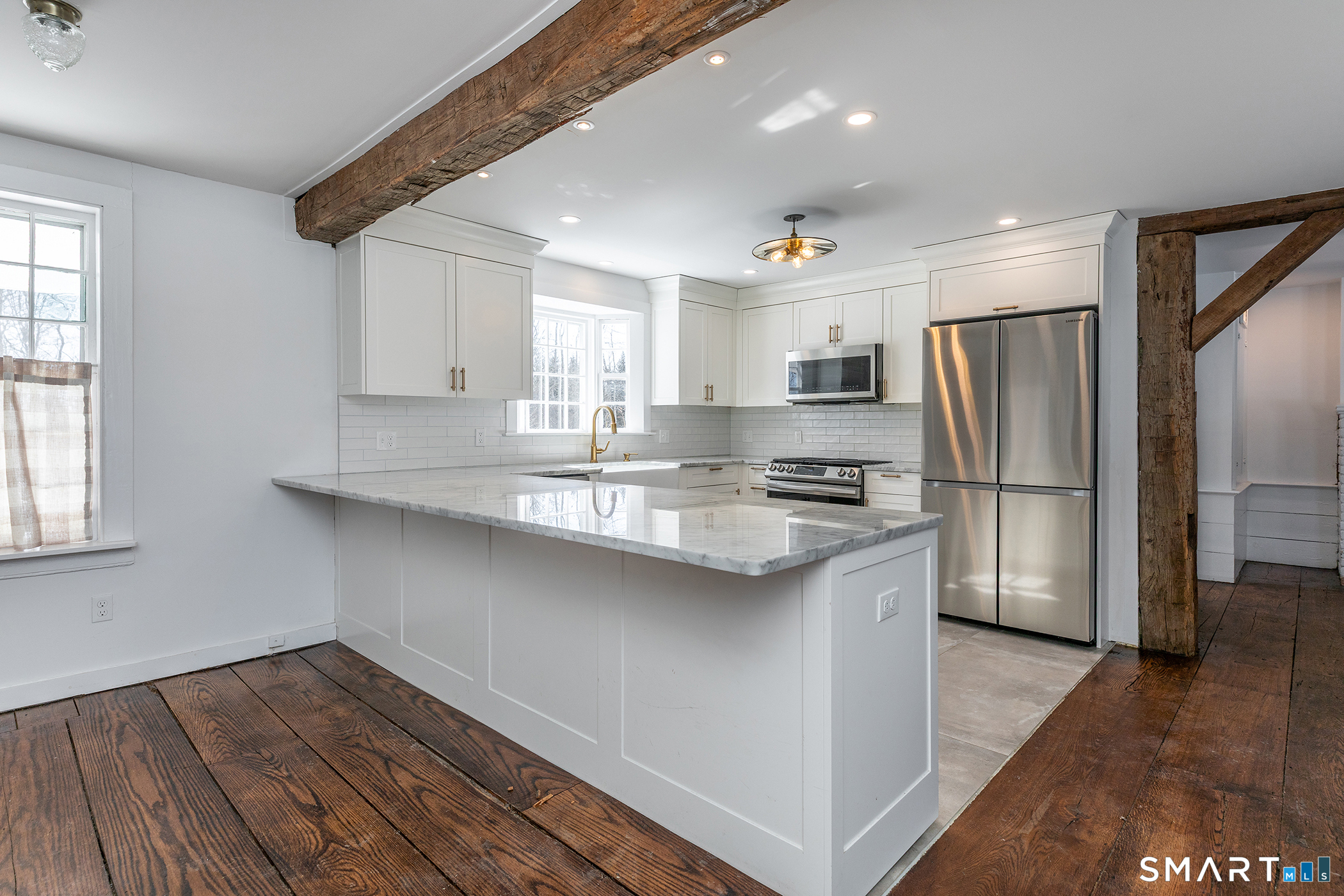 403 Beach Street Litchfield, CT 06759 - Photo 10 of 31 Remodeled kitchen with marble counters and stainless appliances