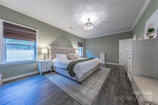 a bathroom with a granite countertop bathtub sink vanity mirror and toilet