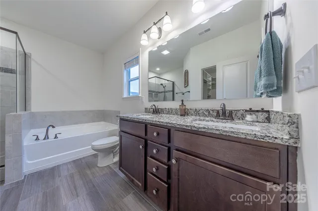 a bathroom with a bathtub and shower