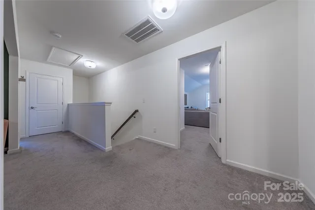a view of a livingroom with furniture and chandelier