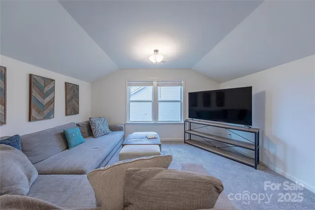 a bathroom with a sink a toilet and shower curtain