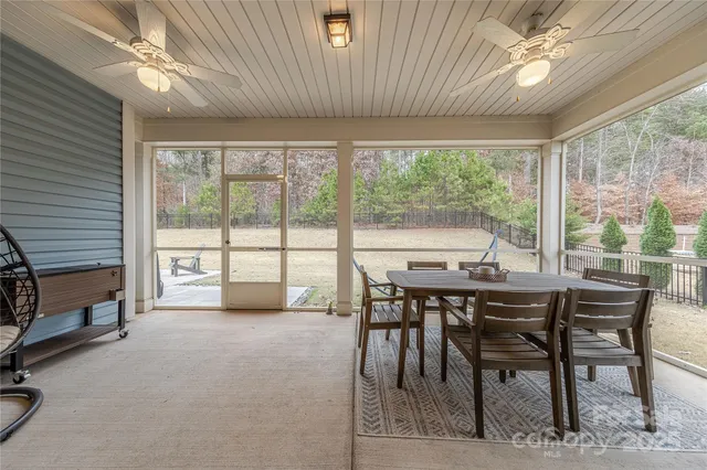 a dining room with furniture window and outside view
