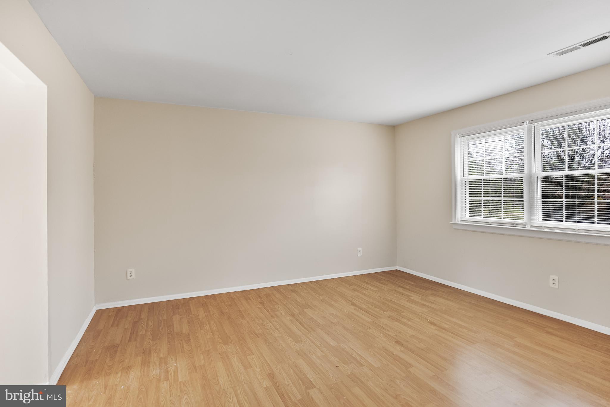 19 Turtle Creek Drive Medford, NJ 08055 - Photo 1 of 9 a view of an empty room with wooden floor and windows