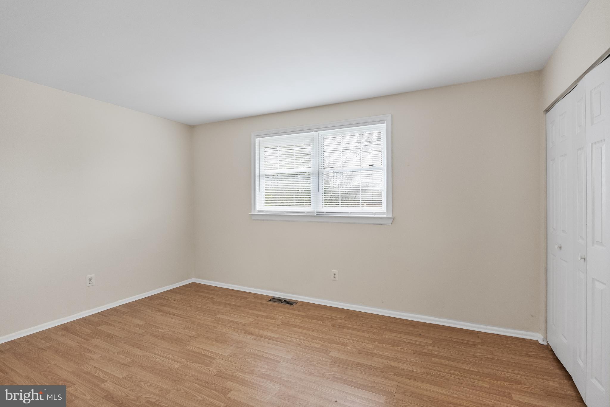 19 Turtle Creek Drive Medford, NJ 08055 - Photo 4 of 9 an empty room with wooden floor and windows