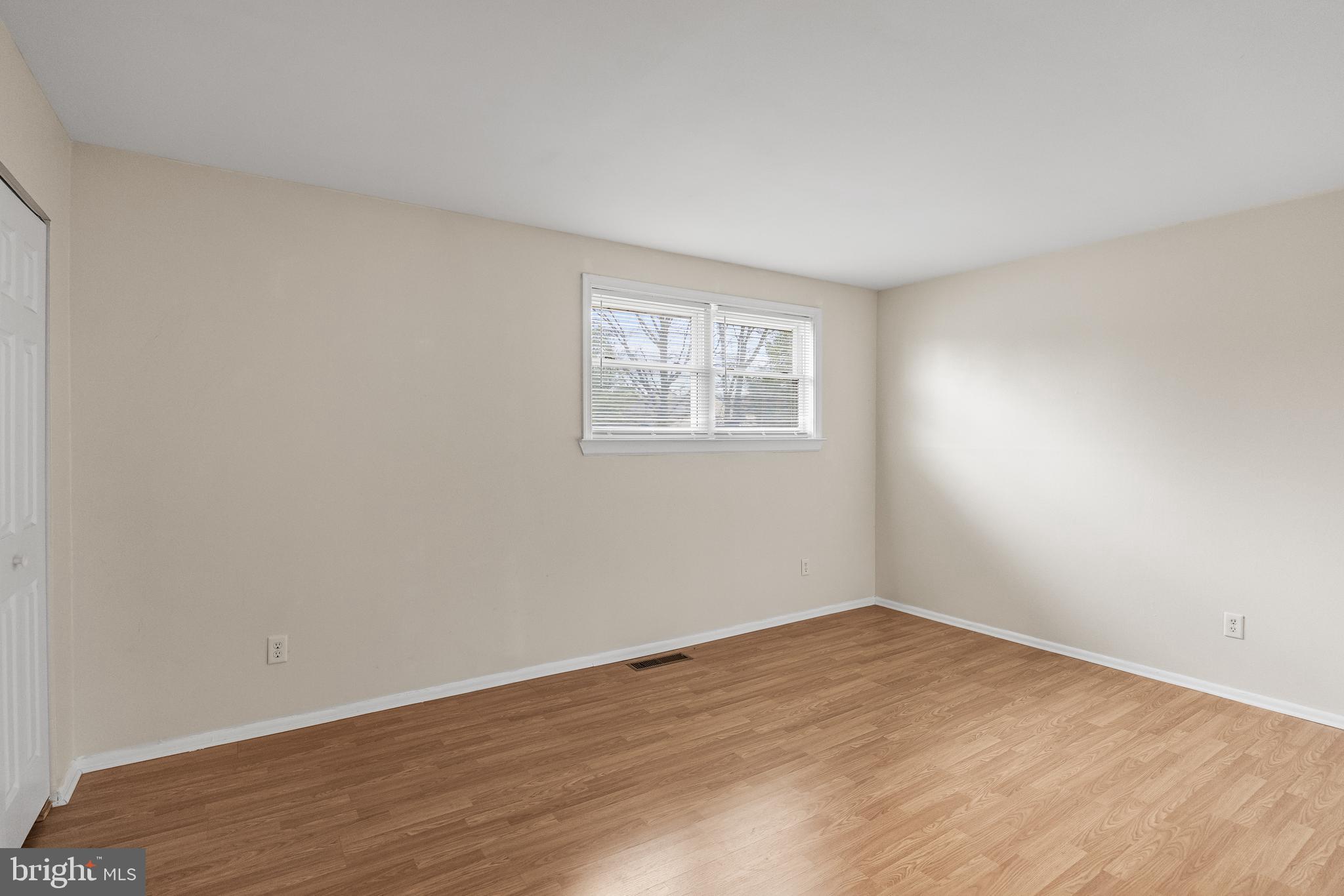 19 Turtle Creek Drive Medford, NJ 08055 - Photo 7 of 9 wooden floor in an empty room with a window