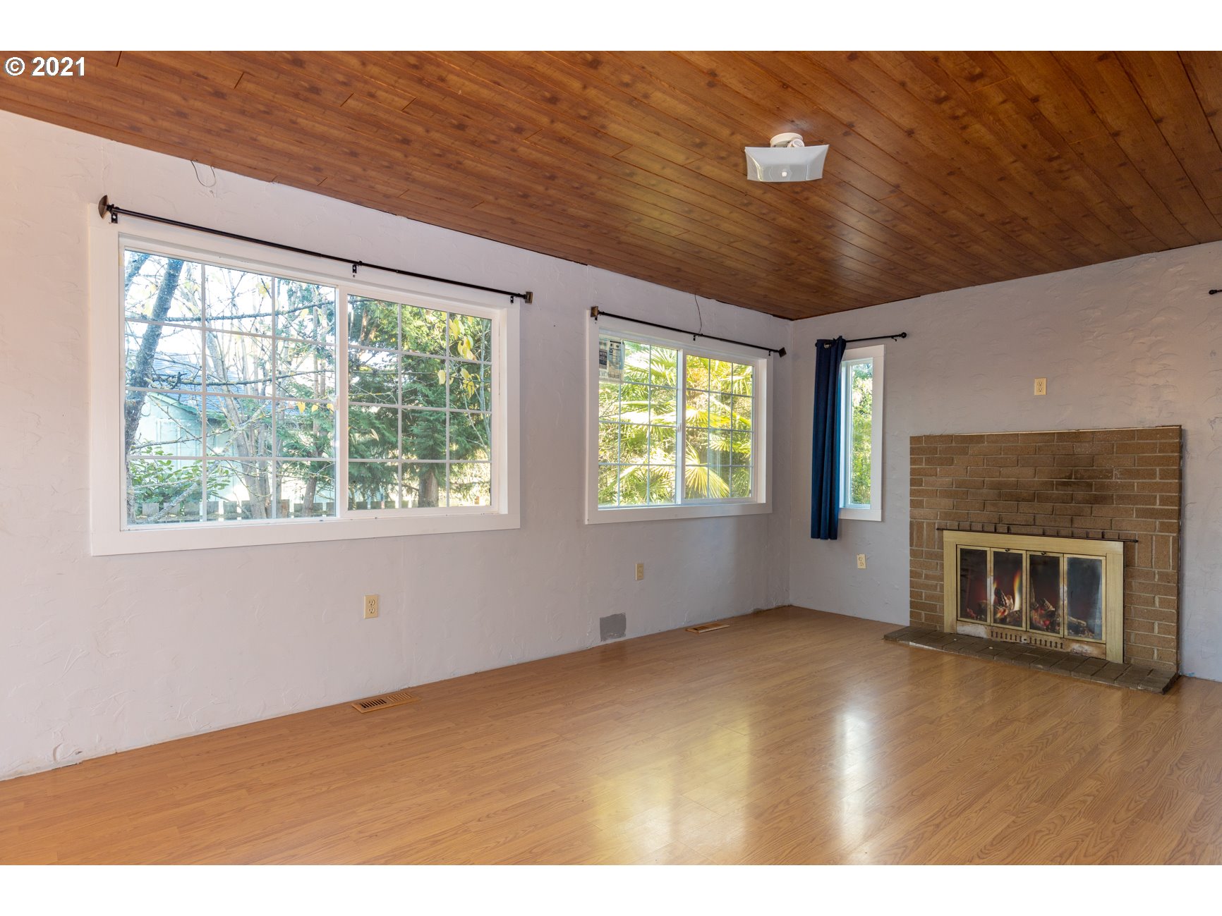 580 3rd Avenue Riddle, OR 97469 - Photo 3 of 30 a view of an empty room with a window and fireplace